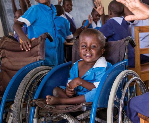 A classroom visit at St. John Paul II Home for Physical Impairment in Lokichar, Kenya. Save the Children partners with the center, to support outreach activities, identify children with disabilities and spread awareness and acceptance in their communities. Save the Children also pays for adaptive items that can help them lead normal lives such as prosthetic limbs, walking aids and specialized shoes. Photo credit: Jonathan Hyams/Save the Children, June 2016.